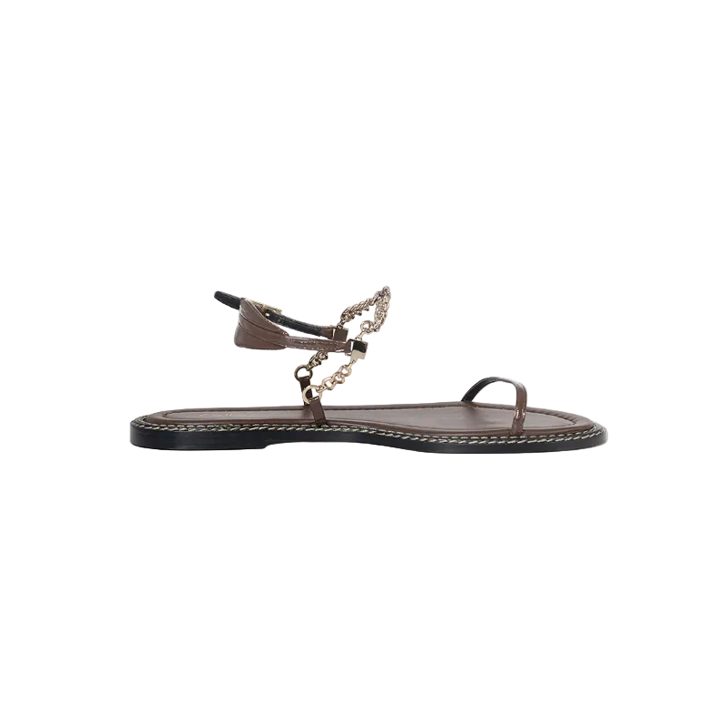 Brown sandal with chain detail on a white background