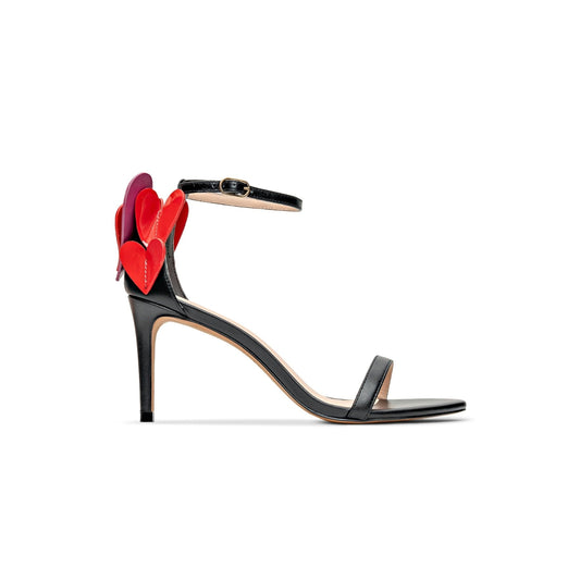Black high-heeled sandal with colorful heart designs on a white background