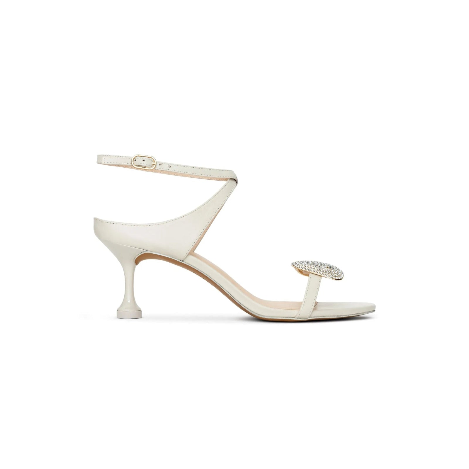 White sandal with a thin strap and small heel on a white background