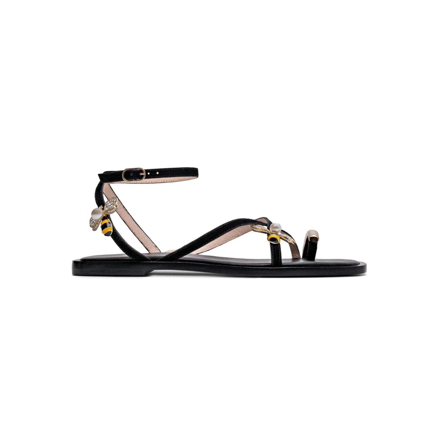 Black sandal with bee embellishments on a white background
