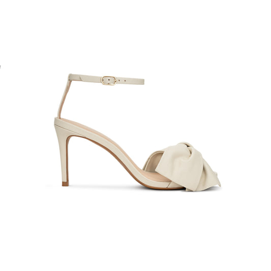 Beige sandal with a bow on a white background